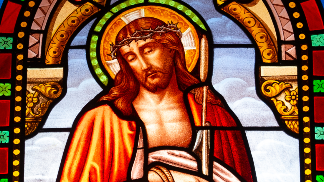 Stained glass window depicting Jesus Christ in the Church of the Assumption in Montpeyroux France.