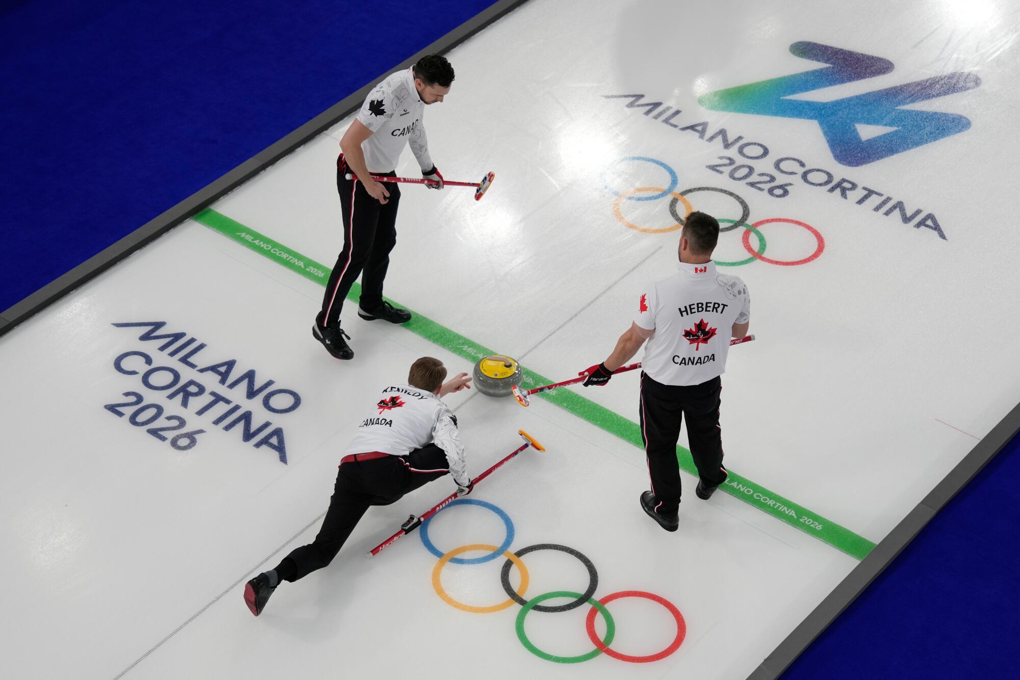 Canada's (from left) Brett Gallant, Marc Kennedy and Ben Hebert compete against the China.