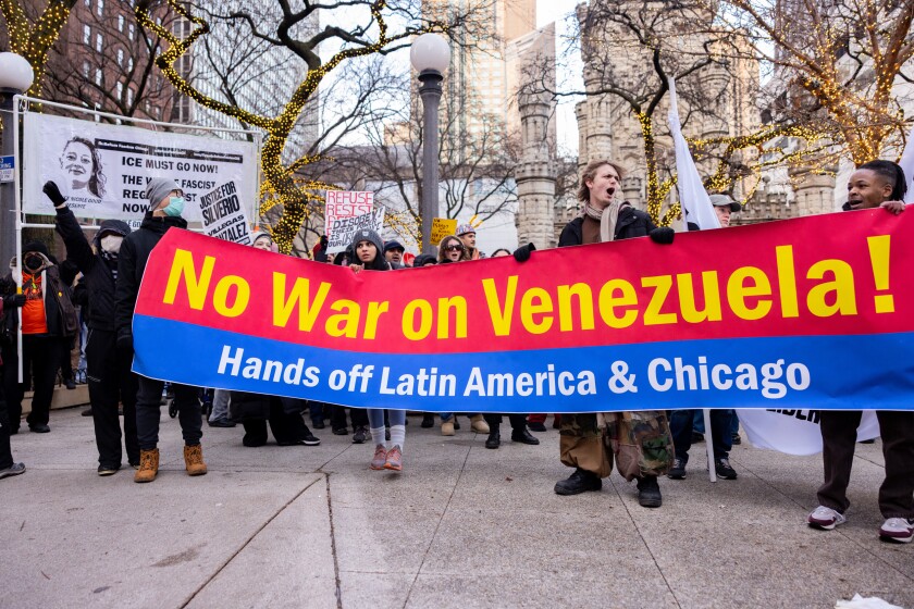 Protesters gather in Water Tower Park downtown to denounce the arrest of Venezuela’s President Maduro and the ICE-involved killings of Renee Nicole Good and Silverio Villegas González as part of a national day of action, Saturday, Jan. 10, 2026.