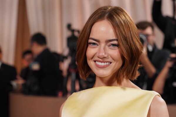Emma Stone arrives at the 83rd Golden Globes on Sunday, Jan. 11, 2026, at the Beverly Hilton in Beverly Hills, Calif. (Photo by Jordan Strauss/Invision/AP)