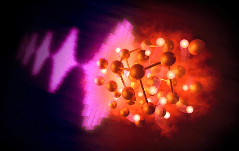 Illustration of intense pulses from an X-ray free-electron laser (left) heating compressed samples of hydrocarbons to extreme conditions, resulting in the reaction of gold and hydrogen to form gold hydride (center). The gold atoms, shown in gold, are fixed in a hexagonal crystal lattice through which the hydrogen, shown in white, diffuses freely in a “superionic” state. 