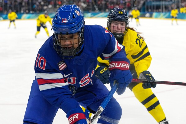 United States' Laila Edwards (10) challenges with Sweden's Felizia Wikner Zienkiewicz (29) during a women's ice hockey semifinal game between the United States and Sweden at the 2026 Winter Olympics, in Milan, Italy, Monday, Feb. 16, 2026. (AP Photo/Hassan Ammar)