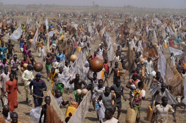 Fishermen run to take part in the Argungu cultural fishing festival in Argungu, Kebbi, northern Nigeria, Feb. 14, 2026. (AP Photo/Sunday Alamba, File)