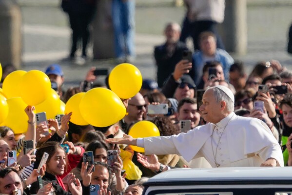 Pope Leo XIV arrives in St. Peter's Square at the Vatican for his open-air weekly general audience, Feb. 18, 2026. (AP Photo/Gregorio Borgia, File)