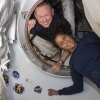 In this photo provided by NASA, Boeing Crew Flight Test astronauts Butch Wilmore (left) and Suni Williams pose for a portrait inside the vestibule between the forward port on the International Space Station's Harmony module and Boeing's Starliner spacecraft on June 13.