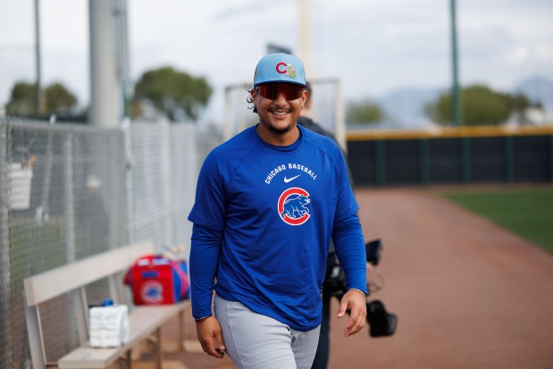Cubs catcher Miguel Amaya walks to a practice field at spring training on Feb. 18, 2026, at Sloan Park in Mesa, Ariz. (Armando L. Sanchez/Chicago Tribune)