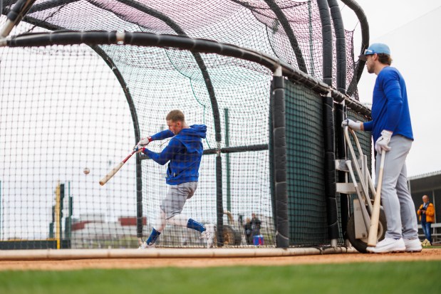 Nico Hoerner watches Pete Crow-Armstrong hit during batting practice during the first day of the Cubs full-squad workout at spring training at Sloan Park on Feb. 16, 2026, in Mesa, Ariz. (Armando L. Sanchez/Chicago Tribune)