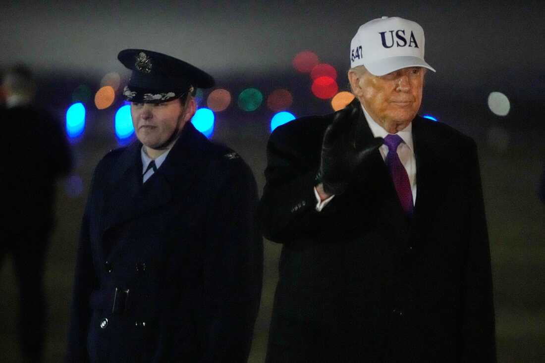 President Donald Trump waves after stepping off Air Force One, Thursday, Feb. 19, 2026, at Joint Base Andrews, Md., on return from a trip to Georgia.