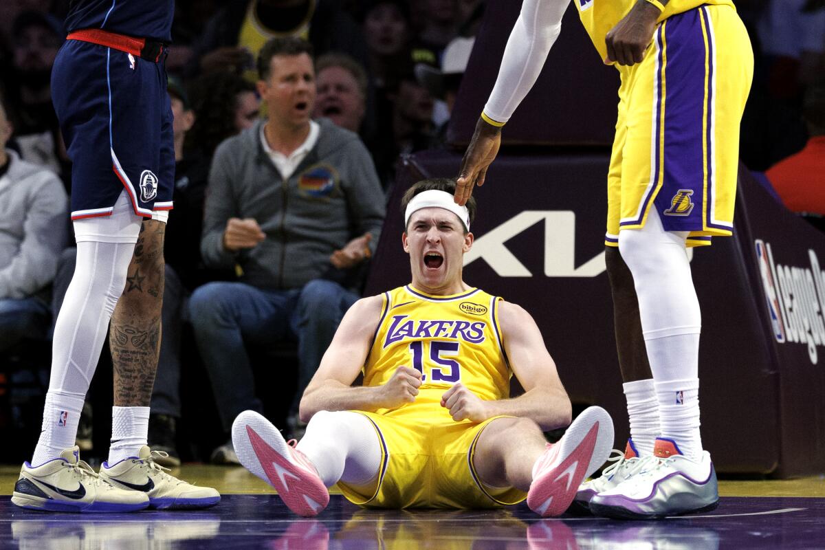 Lakers guard Austin Reaves celebrates after Clippers guard Bennedict Mathurin was called for an offensive foul.