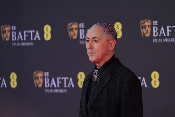 Alan Cumming poses for photographers upon arrival at the 79th British Academy Film Awards, BAFTA's, in London, Sunday, Feb. 22, 2026. (AP Photo/Alberto Pezzali)