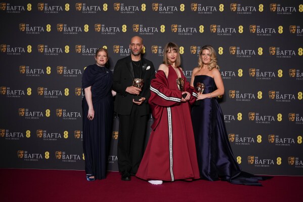 Lauren Frankfort Meltzer, from left, Matt Houghton, Georgie Wileman, and Harriette Wright pose with the award for British short film for 'This Is Endometriosis' at the 79th British Academy Film Awards, BAFTA's, in London, Sunday, Feb. 22, 2026. (AP Photo/Alastair Grant)