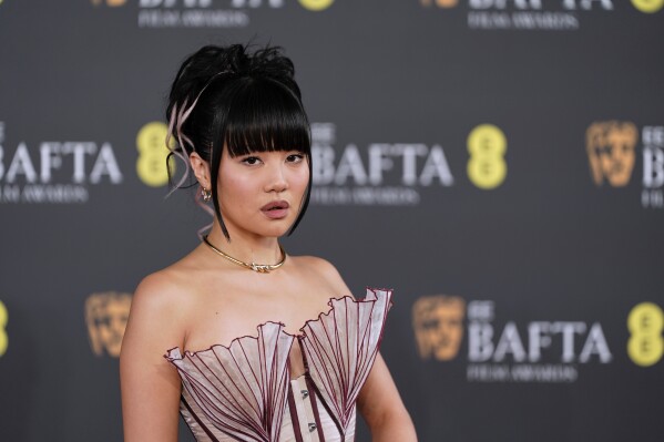 Rei Ami poses for photographers upon arrival at the 79th British Academy Film Awards, BAFTA's, in London, Sunday, Feb. 22, 2026. (AP Photo/Alberto Pezzali)