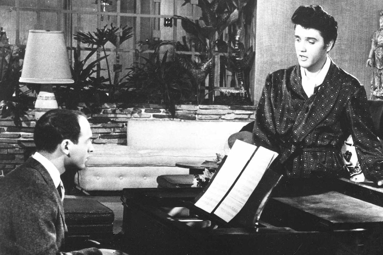 From left: Mike Stoller and Elvis Presley in 1957 Michael Ochs Archives/Getty