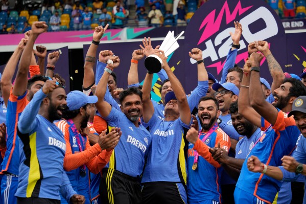 India's players celebrate with the winners' trophy after winning against South Africa in the ICC Men's T20 World Cup final cricket match at Kensington Oval in Bridgetown, Barbados, June 29, 2024. (AP Photo/Ramon Espinosa, File)