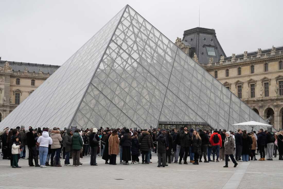 People line up outside the Louvre Museum, in Paris, Feb. 13.