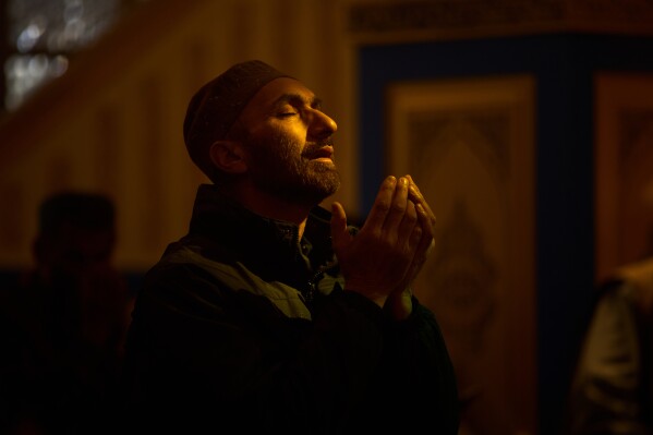 A Kashmiri Muslim man prays inside the Hazratbal Shrine, which houses a relic believed to be a hair from the beard of the Prophet Muhammad, during Ramadan in Srinagar, Indian controlled Kashmir, Wednesday, Feb. 25, 2026. (AP Photo/Dar Yasin)