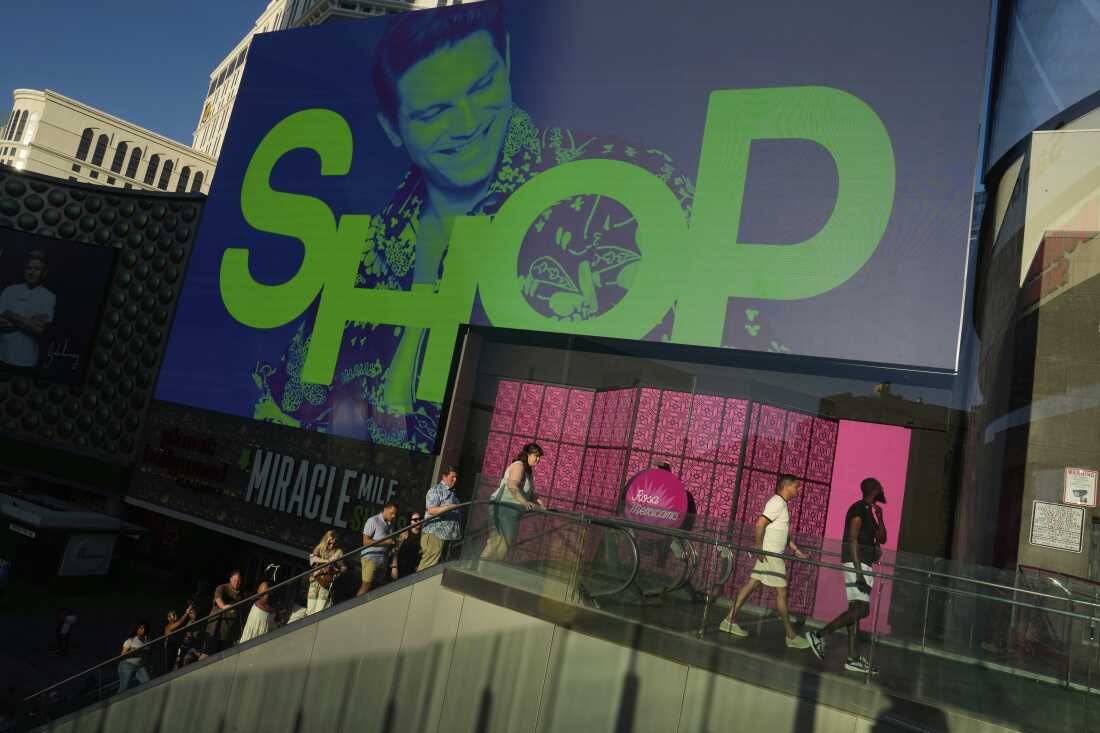 People walk by a shopping mall along the Las Vegas Strip on April 8, 2025.