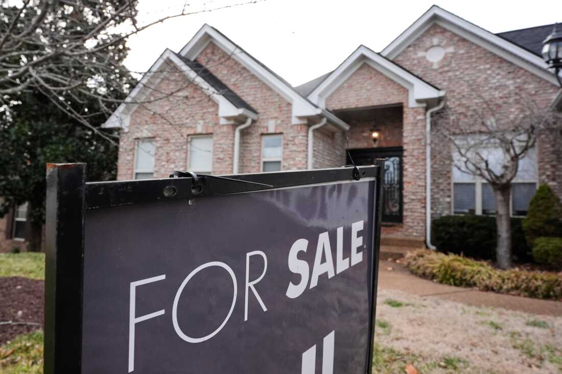 A for-sale sign stands outside a home in Nashville, Tennessee, on February 10.