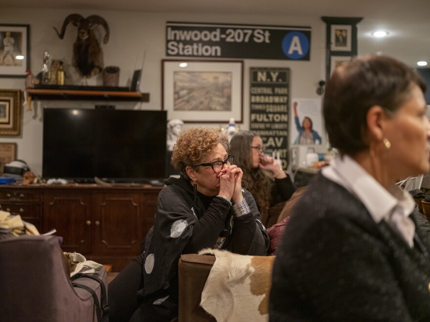 Carolina Pérez, center, listens to fellow members speak during at a Las Comadres Para Las Americas meeting in Austin, Texas on Jan. 27. She says she's terrified for the safety of her Cuban-born U.S. naturalized citizen husband and her 19-year old son.