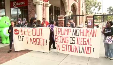 Protesters march through Target store at USC Village to denounce ICE actions and demand store ban agents from store properties