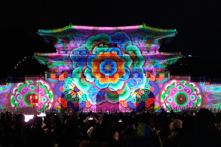 Media art illuminates the facade of Gwanghwamun, the main gate of Gyeongbok Palace, during Seoul Winter Festa in central Seoul, Dec. 12, 2025. AP-Yonhap