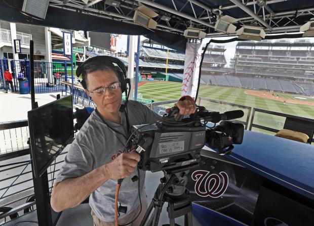 Camera operator Jim Novosel prepared his camera for a pregame show at a Nationals game. (Kenneth K. Lam / Baltimore Sun, Kenneth K. Lam / Baltimore Sun)