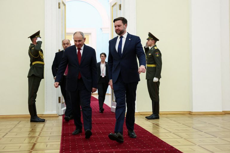 U.S. Vice President JD Vance and Armenia's Prime Minister Nikol Pashinyan walk together to hold a joint press conference in Yerevan