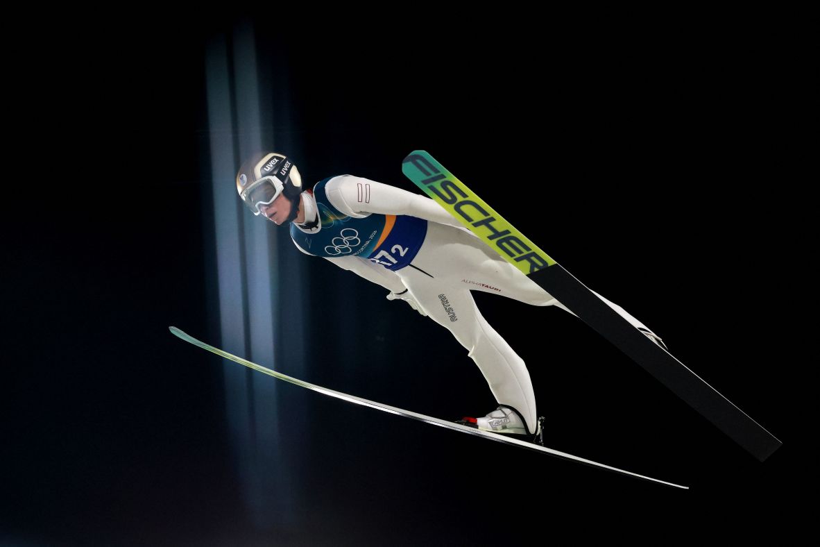 Stephan Embacher of Austria competes in the men's super team ski jumping finals on February 16. <a href=