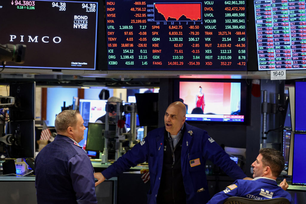 Traders work on the floor of the NYSE in New York