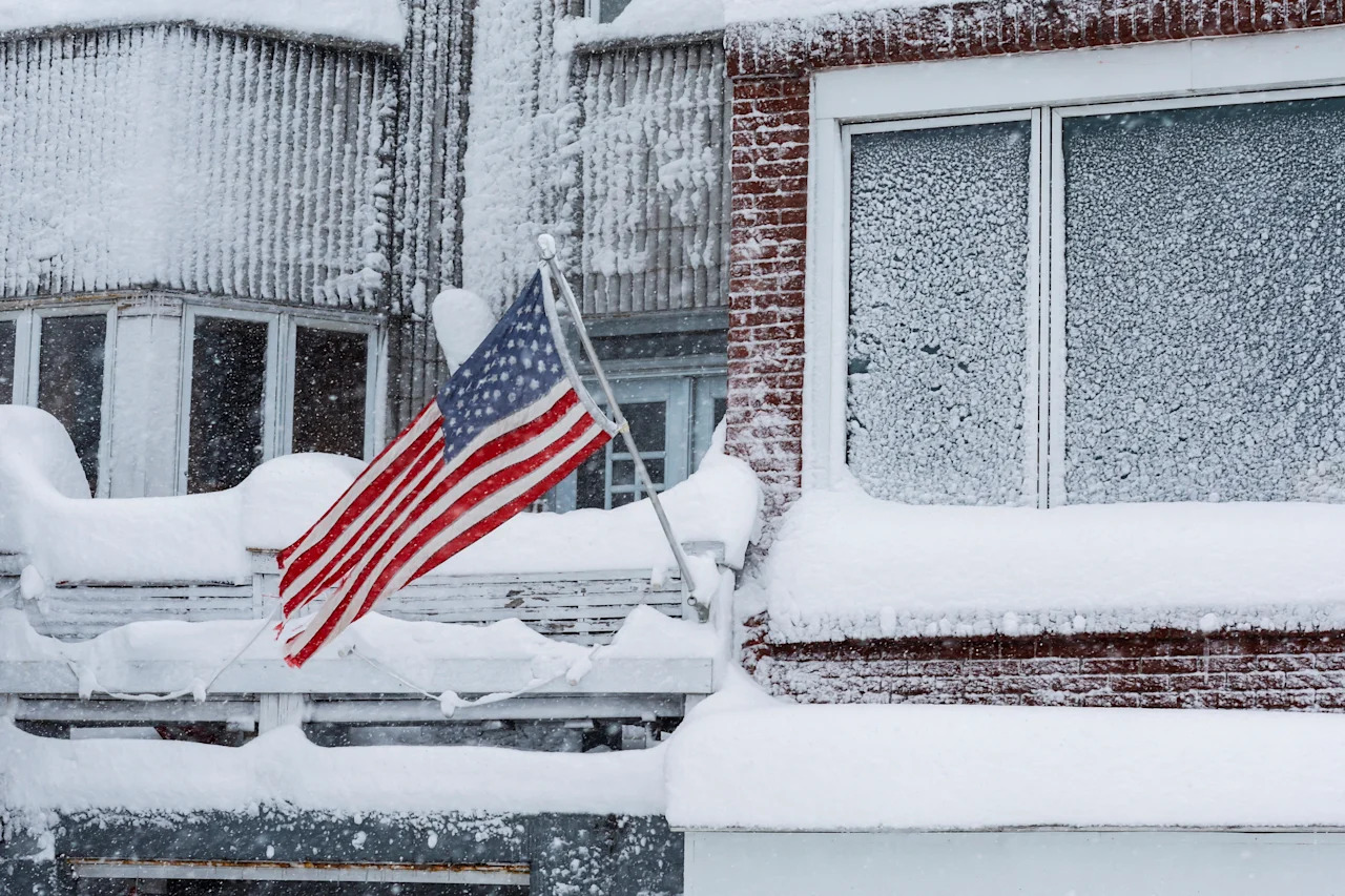 A U.S. flag waves during a winter storm in West New York, N.J., on Feb 23. 