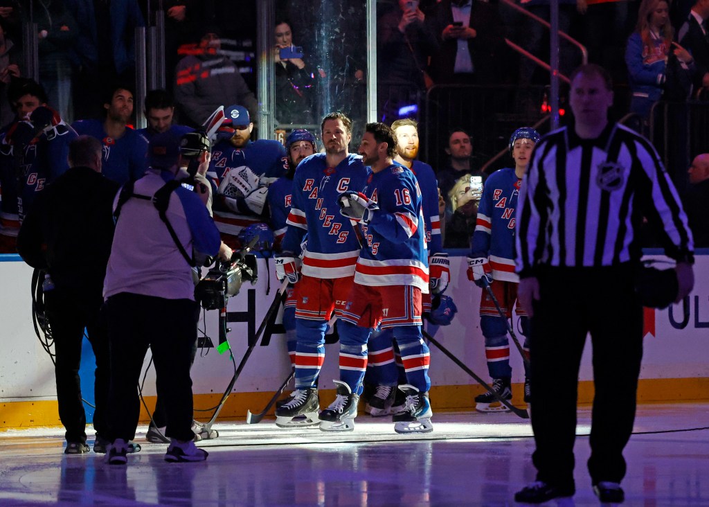 New York Rangers center Vincent Trocheck (16) and New York Rangers center J.T. Miller (8) are honored by the New York Rangers along with New York Rangers head coach Mike Sullivan after winning Olympic gold with Team USA in a pre game ceremony when the New York Rangers played the Philadelphia Flyers Thursday, February 26, 2026