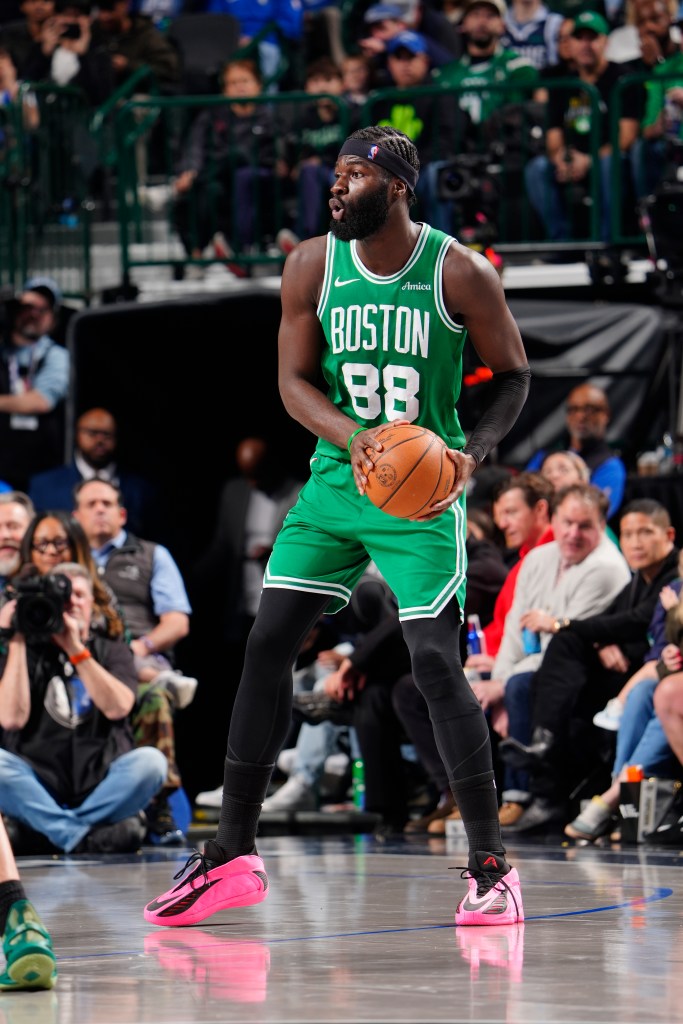 Neemias Queta looks to pass the ball.