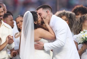 SANTA CLARA, CALIFORNIA - FEBRUARY 08: A couple marries during the Bad Bunny performance onstage at the Apple Music Super Bowl LX Halftime Show at Levi's Stadium on February 08, 2026 in Santa Clara, California.