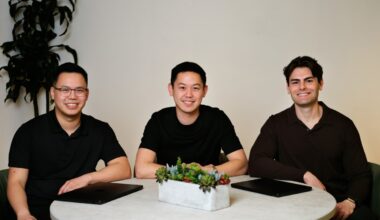 Three men in black shirts sit around a circular table: Meridian CTO George Fang, CEO John Ling and COO Zach Kirshner