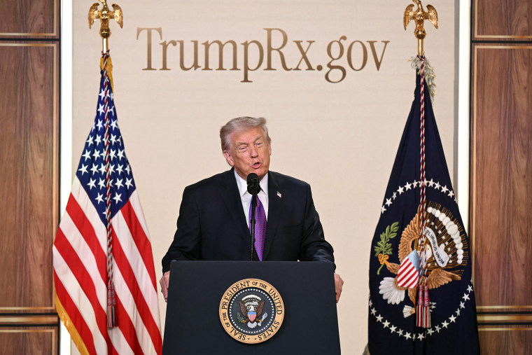 President Trump stands at a lectern bearing the seal of the presidency. 