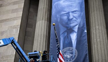 Large banner of Trump unfurled at Justice Department headquarters