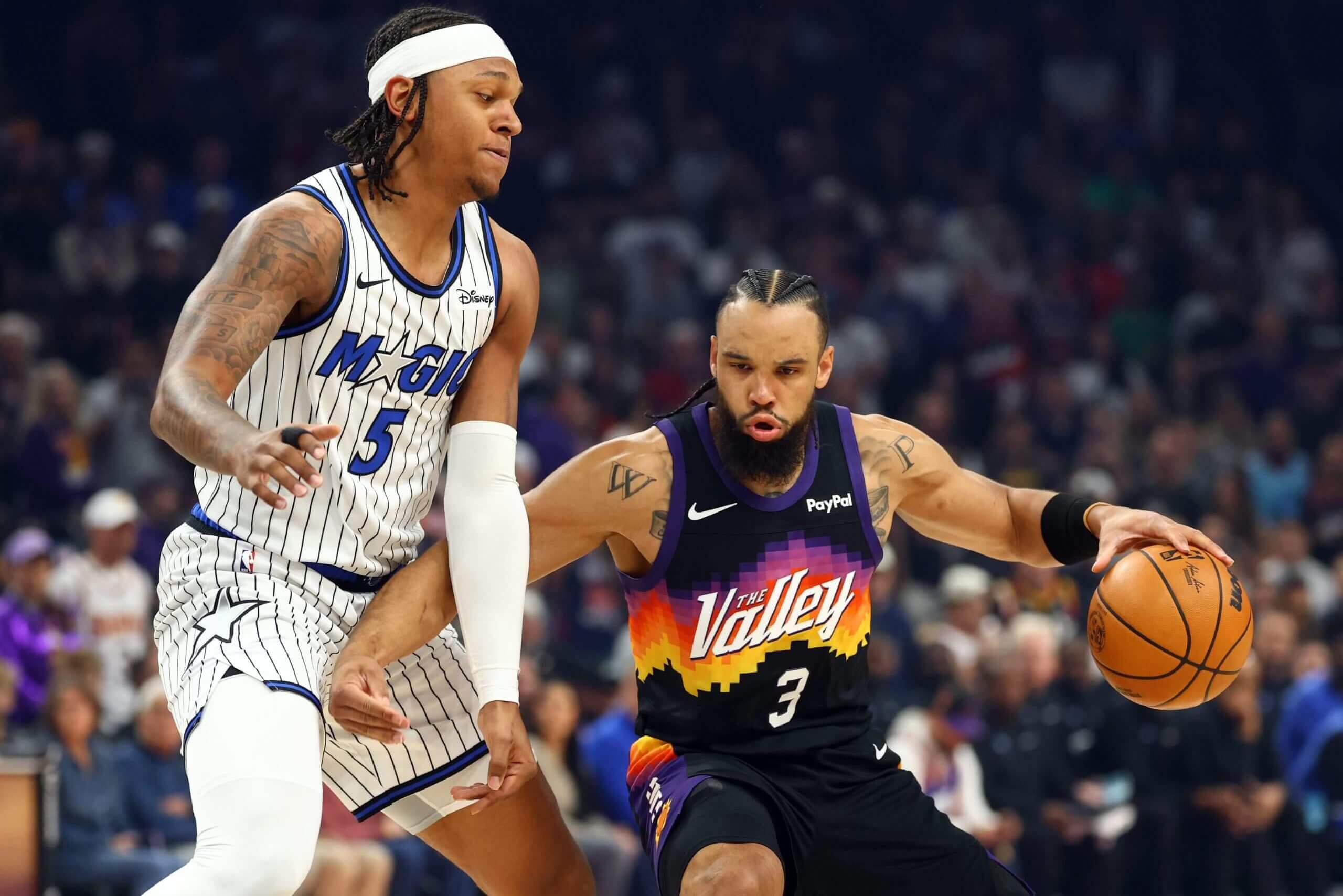 A photo of Orlando's Paolo Banchero and Phoenix's Dillon Brooks