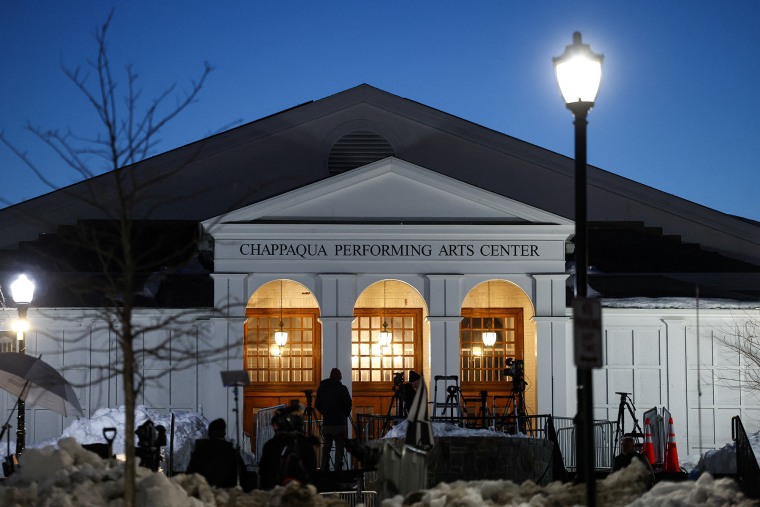 Media crews gather in front of The Chappaqua Performing Arts Center in Chappaqua, N.Y., early February 27, 2026, ahead of the deposition of Bill Clinton. 