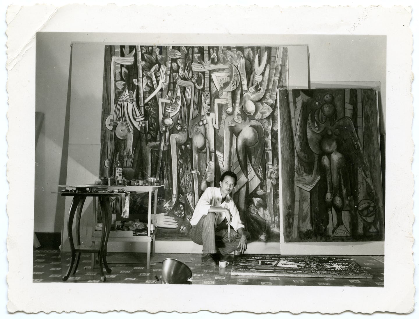 Wifredo Lam with "La Jungla"  in his Havana studio, 1943. Archives SDO Wifredo Lam, Paris.