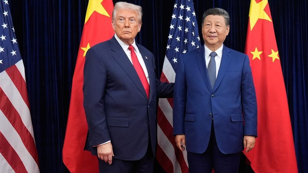 FILE - President Donald Trump, left, and Chinese President Xi Jinping pose ahead of their summit talk at Gimhae International Airport in Busan, South Korea, Oct. 30, 2025. (AP Photo/Mark Schiefelbein, File