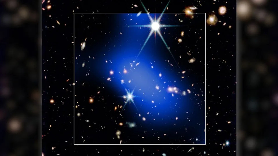 A bright blue streak of light is seen covering a series of bright stars in this dark deep space image. A white box surrounds the blue shape.