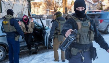 Immigration agents draw guns, arrest activists following them in Minneapolis