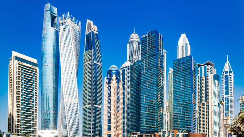 Skyscrapers in Dubai, including the Dubai Marina, Ciel Tower, Cayan Tower, DAMAC Heights, and Princess Tower