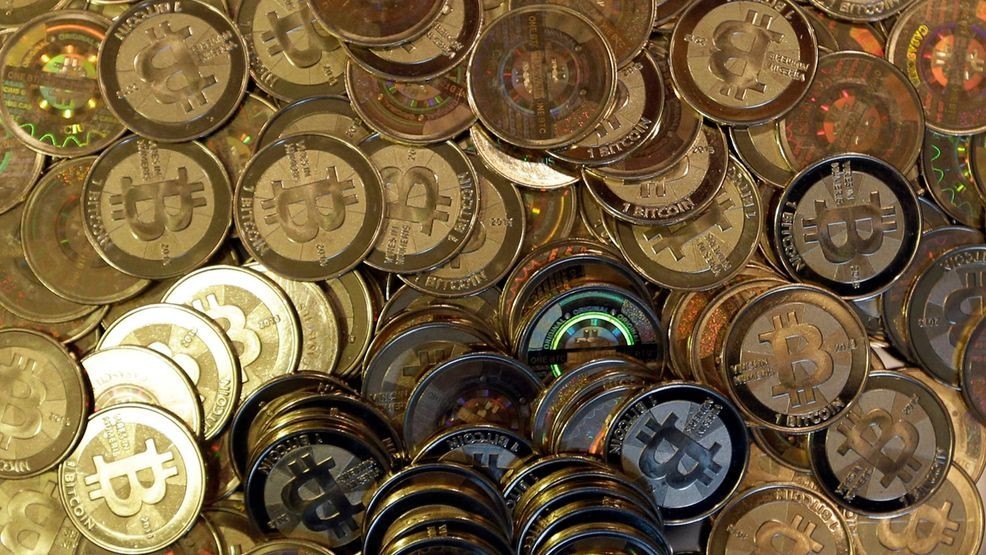 FILE - Bitcoin tokens are seen on April 3, 2013, in Sandy, Utah. (AP Photo/Rick Bowmer, File)