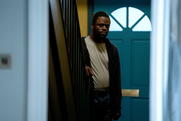 534389,TITLE:Eastenders Kojo looks shifty in Phil Mitchell's hallway in EastEnders