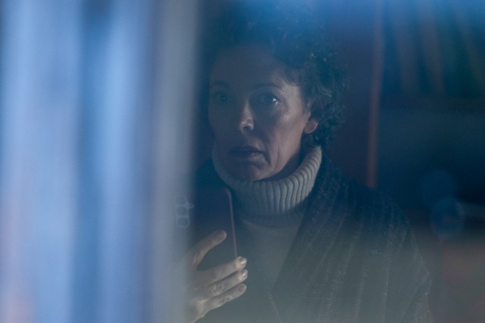 547905,TITLE: The Night Manager S2 Olivia Colman stars in The Night Manager season 2; in this scene, Angela is seen through a window, speaking into her mobile phone worriedly