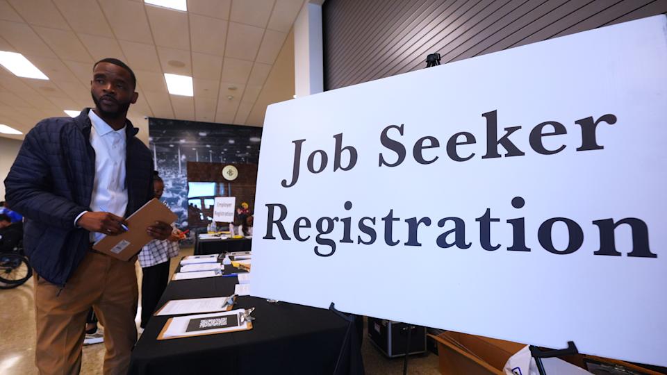 Job seeker Tavion Lacey arrives for a hiring fair in Dallas, Wednesday, Jan. 14, 2026. (AP Photo/LM Otero)