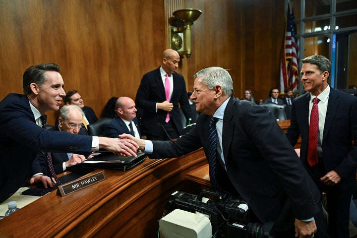 Sarandos, right, shook hands with Missouri Sen. Josh Hawley (R), left, after a contentious Senate subcommittee hearing about the streamer's proposed merger with Warner Bros. Discovery.