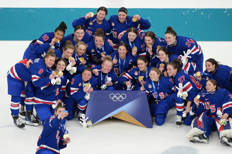 Team United States players pose together after receiving their gold medals after the women's...