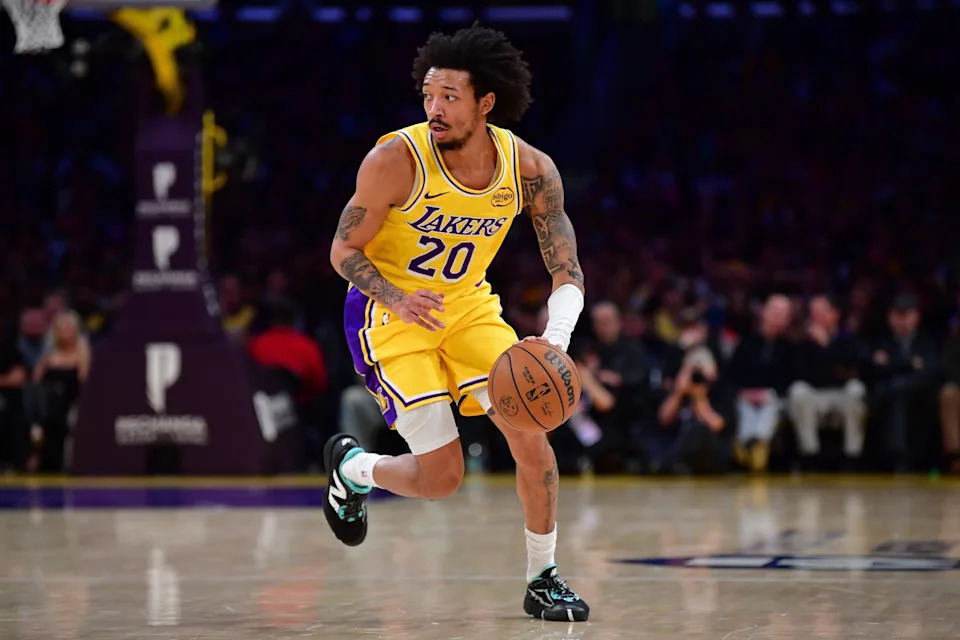 Feb 10, 2026; Los Angeles, California, USA; Los Angeles Lakers guard Nick Smith Jr. (20) moves the ball against the San Antonio Spurs during the first half at Crypto.com Arena. Mandatory Credit: Gary A. Vasquez-Imagn Images